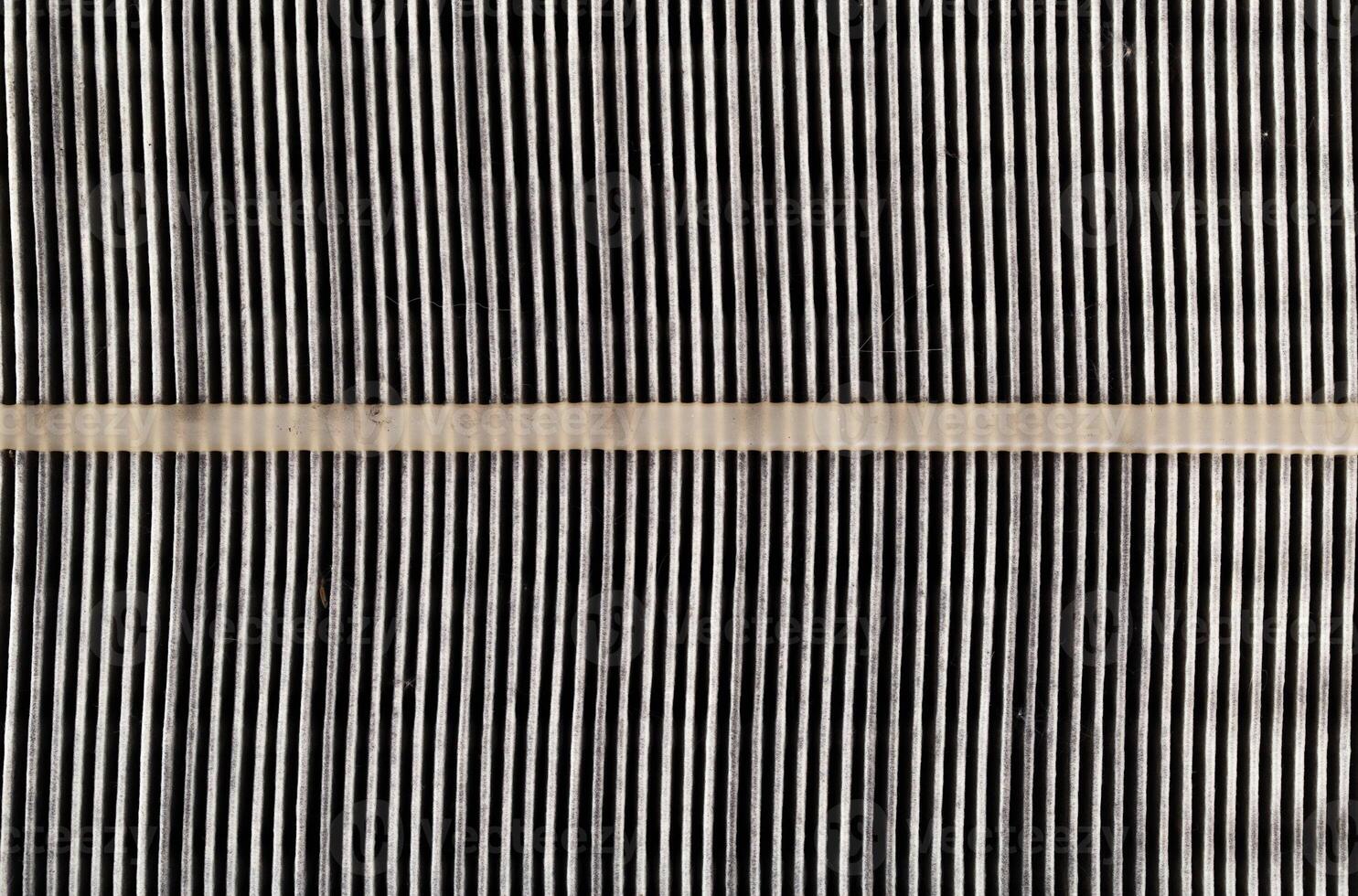 Dirty car air filter texture and background. Air filter element in a car engine, macro, damaged photo