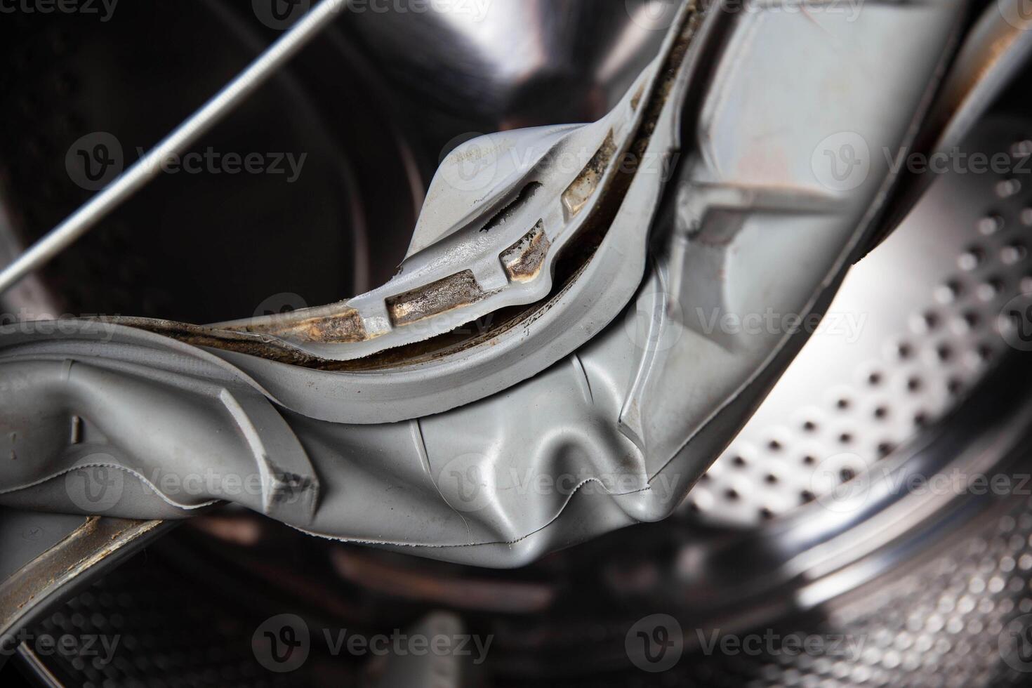 Old rubber hatch seal with washing machine defect, industry photo