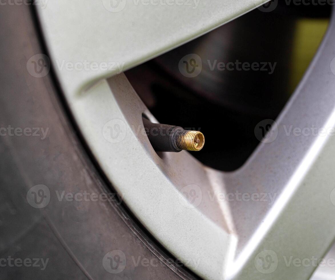 car wheel spool, close-up. Wheel deflation concept, malfunction photo