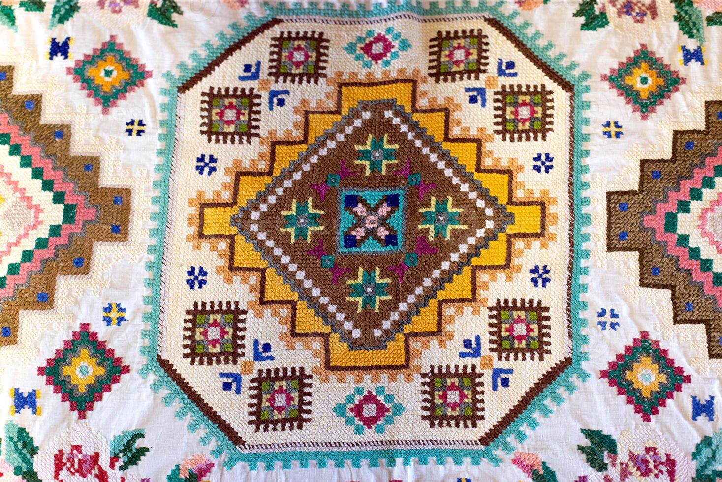 Traditional rustic tablecloth with handmade patterns and embroidery, macro photo