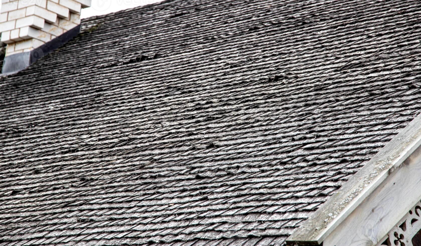 shingle roof. Old method of making roofs from wood, background. Copy space for text, architectural photo