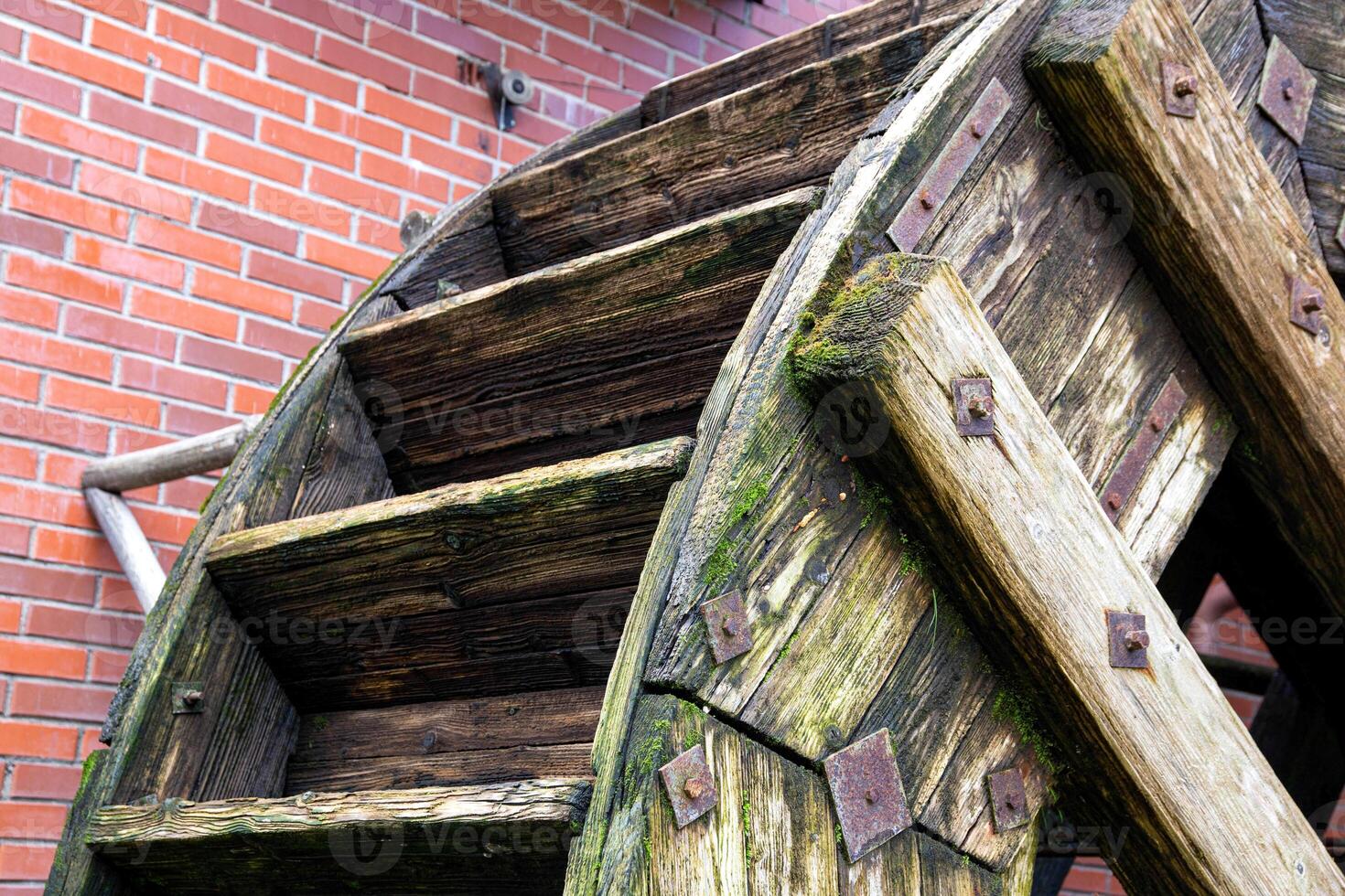 Old wooden water mill, antique style, background. Hydrotechnical photo