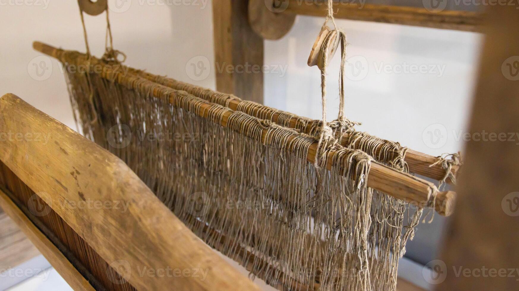 Old loom. Device for the manufacture of textile products, close-up, traditional photo