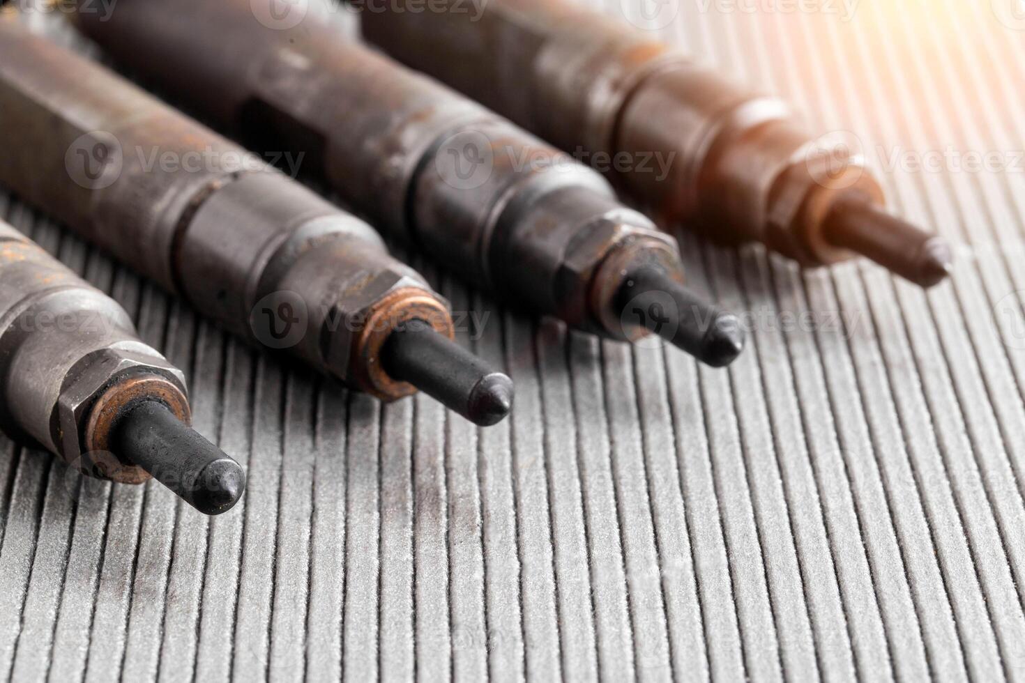 Mechanical injectors from a diesel engine, close-up. Fuel atomization, diesel fuel quality. Close-up, copy space for text photo