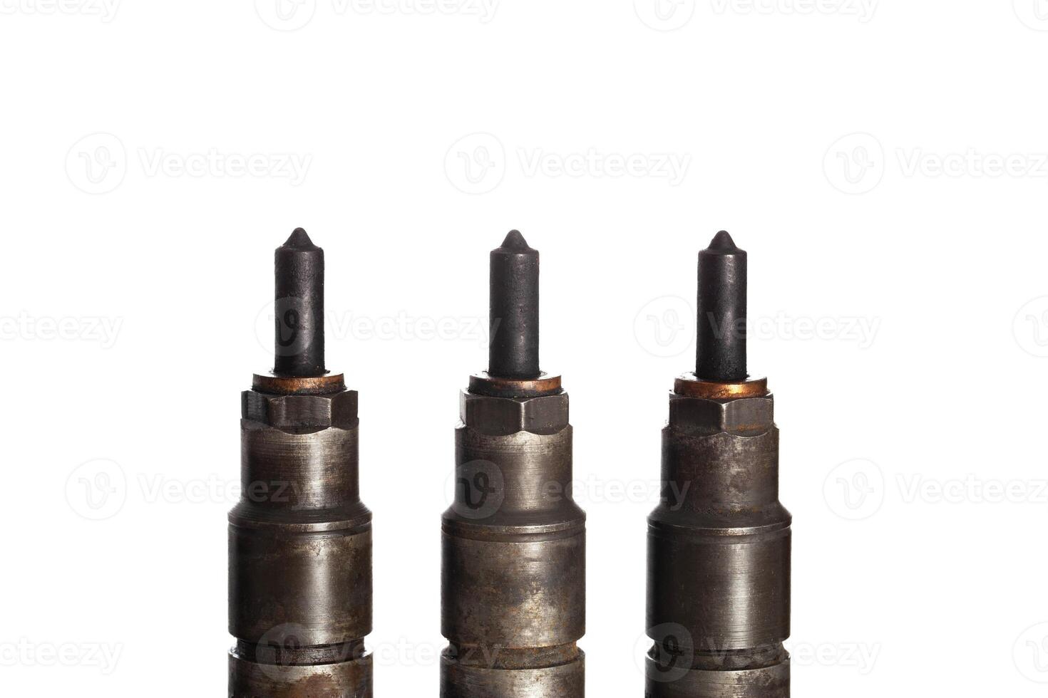 Needles and nozzles on nozzles from a diesel engine. Deterioration of the fuel system of the car, macro. White background, isolate photo