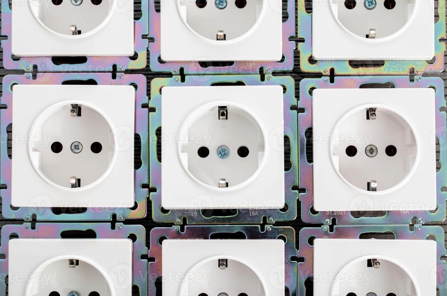 Background from home electric sockets, close-up. The concept of tariffs and prices for electricity photo