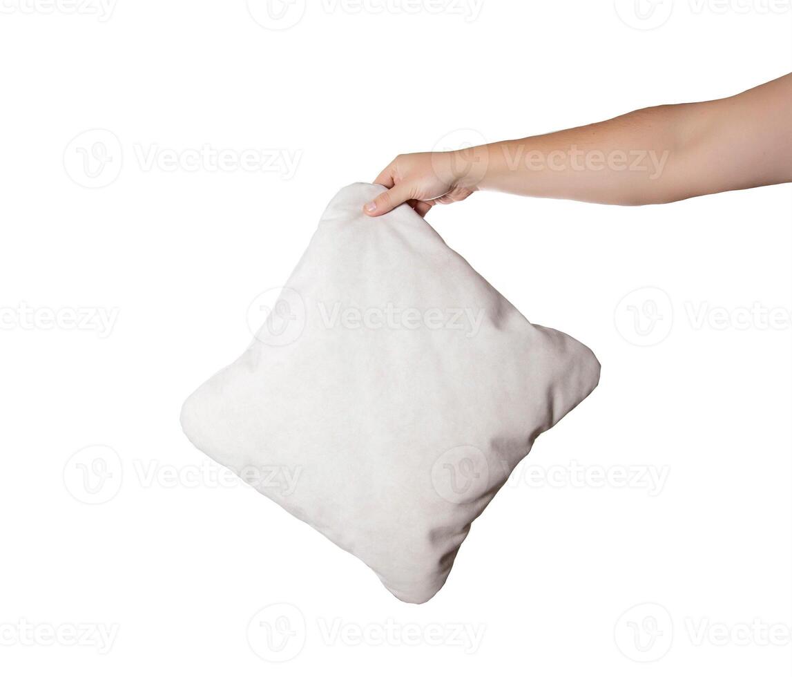 Gray pillow in a man's hand on a white background, isolate. Close-up photo