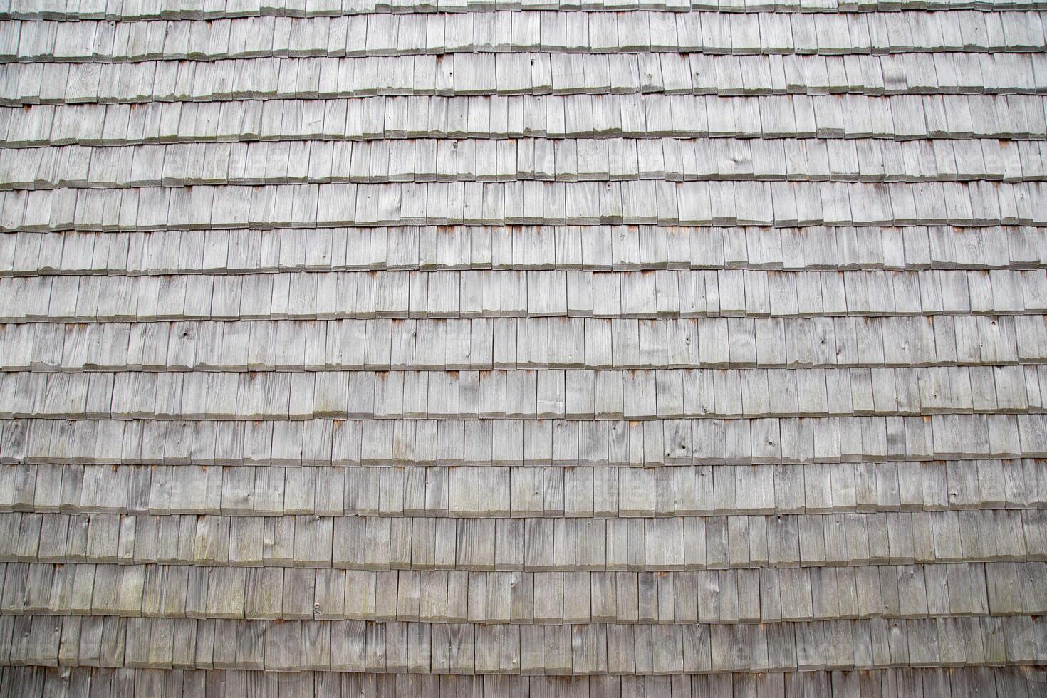 shingle roof. Old method of making roofs from wood, background. Copy space for text photo
