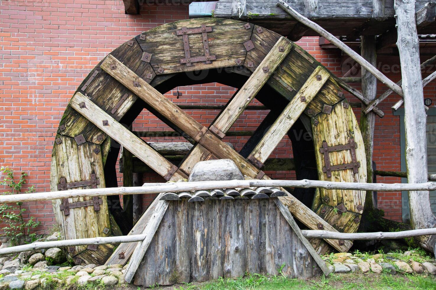 Old wooden water mill, antique style, background. Hydrotechnical photo
