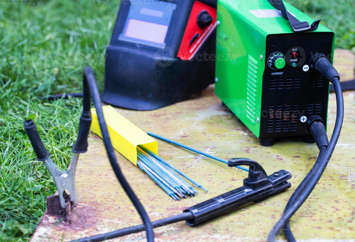 Manual welding machine and a set of electrodes for seam contact welding. Safety precautions during welding, industry photo
