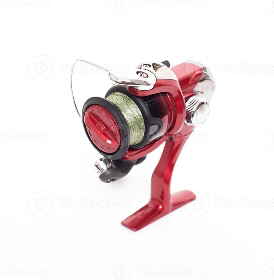 Red fish reel for fishing and spinning for fishing, isolate, baytraner photo