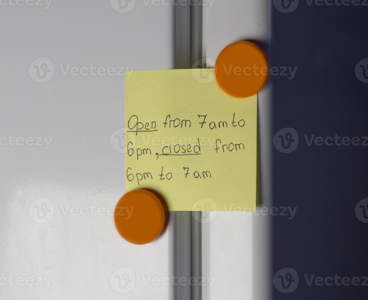 Yellow sticker on the refrigerator door photo
