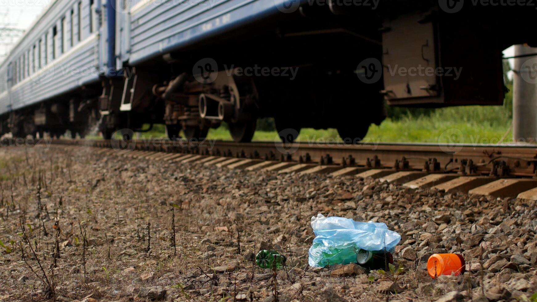Rubbish on the railway thrown out of the train window, pollution, railway and litter photo