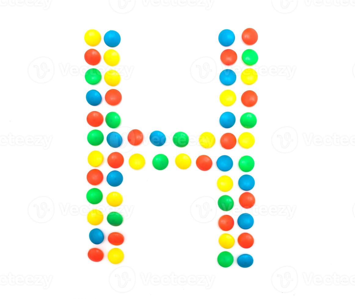 Multicolored alphabet from children's mosaic letter H photo