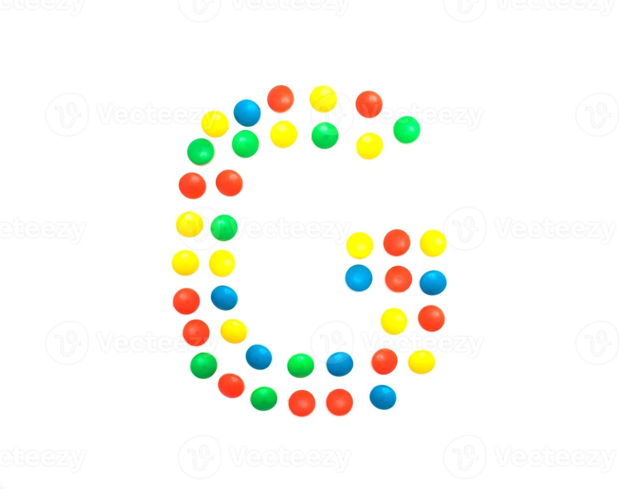 Multicolored alphabet from children's mosaic letter G photo