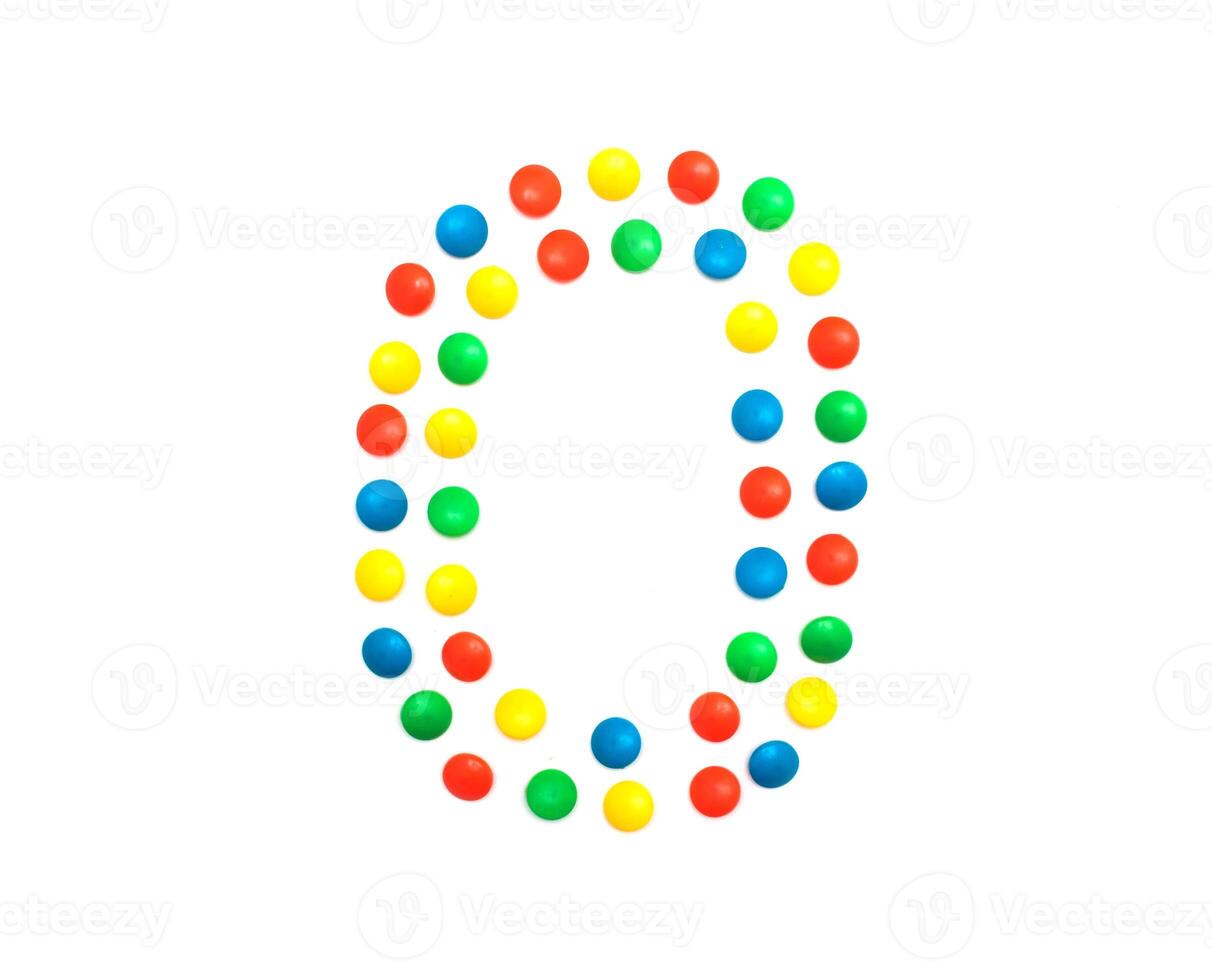 Children's numbers laid out from a multi-colored mosaic figure number 0, alphabet photo