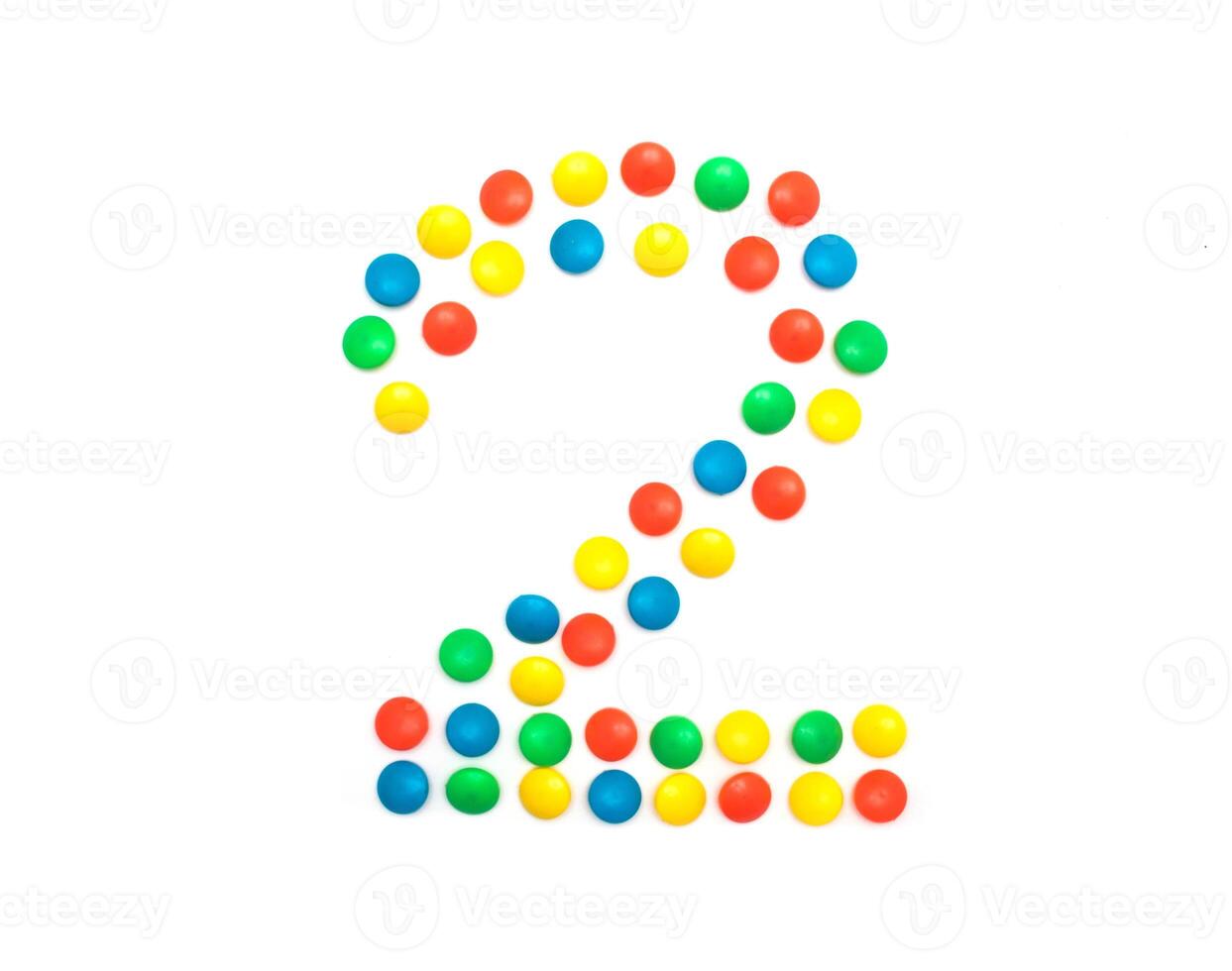 Children's numbers laid out from a multi-colored mosaic figure number 2, alphabet photo