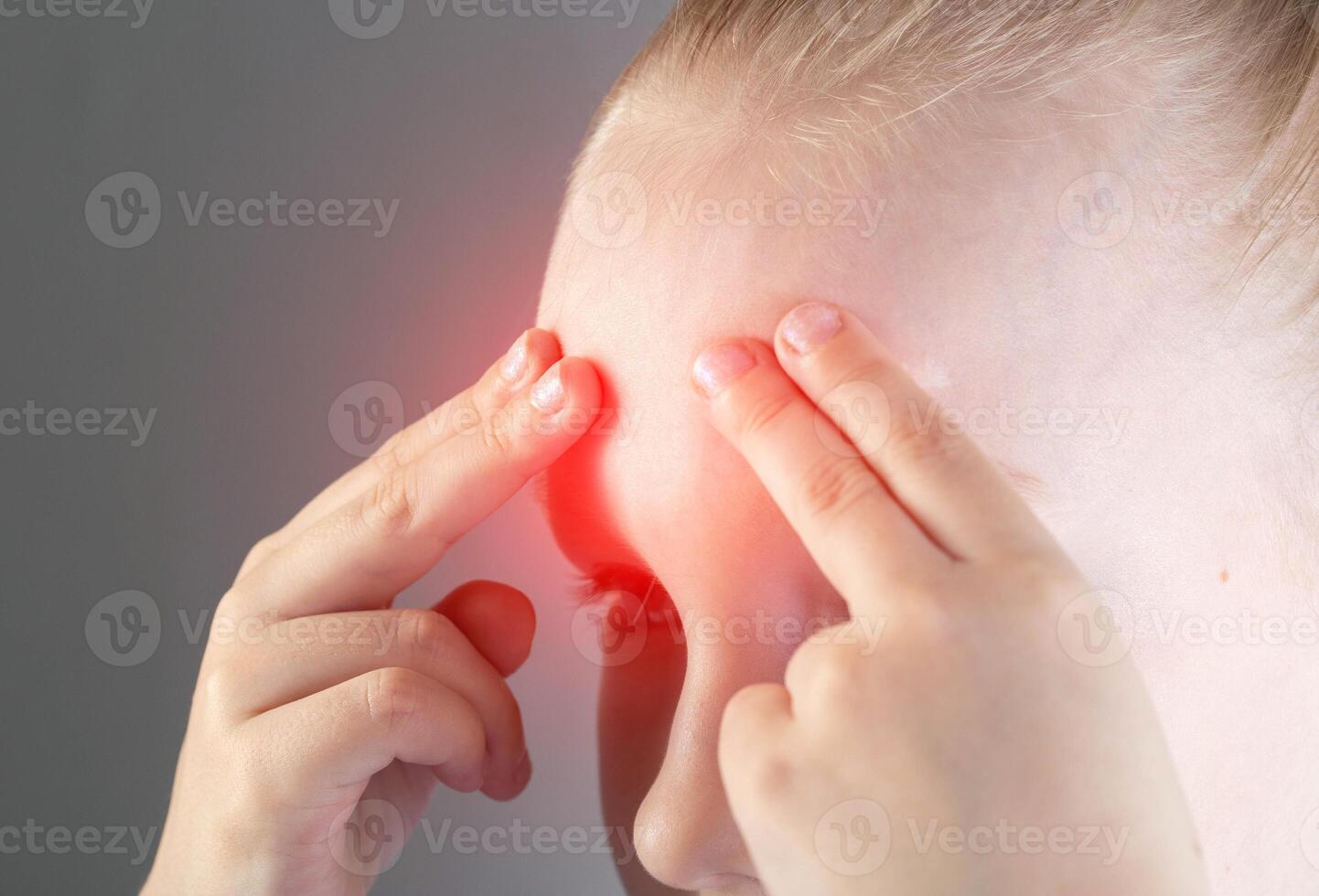 The girl holds her forehead and head with her fingers. Concept of pain in the head and forehead due to sinusitis. Concept bacterial and viral sinusitis. Treatment of inflammation and nasal congestion photo