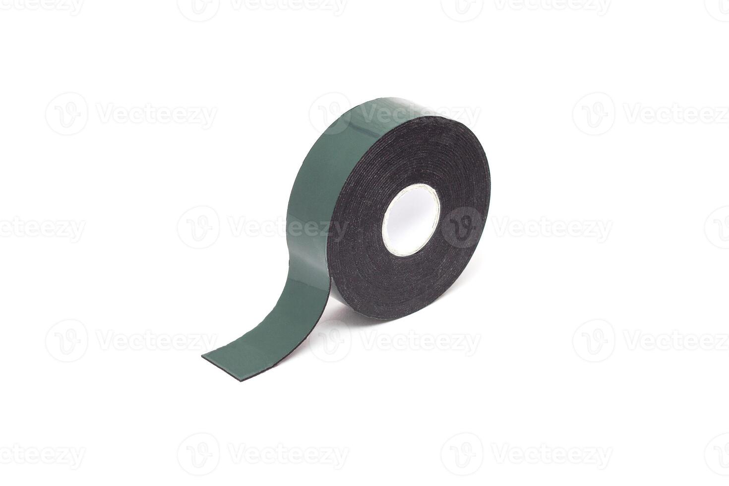 Reel of double-sided tape on a white background, isolate, green double-sided tape, close-up, material photo