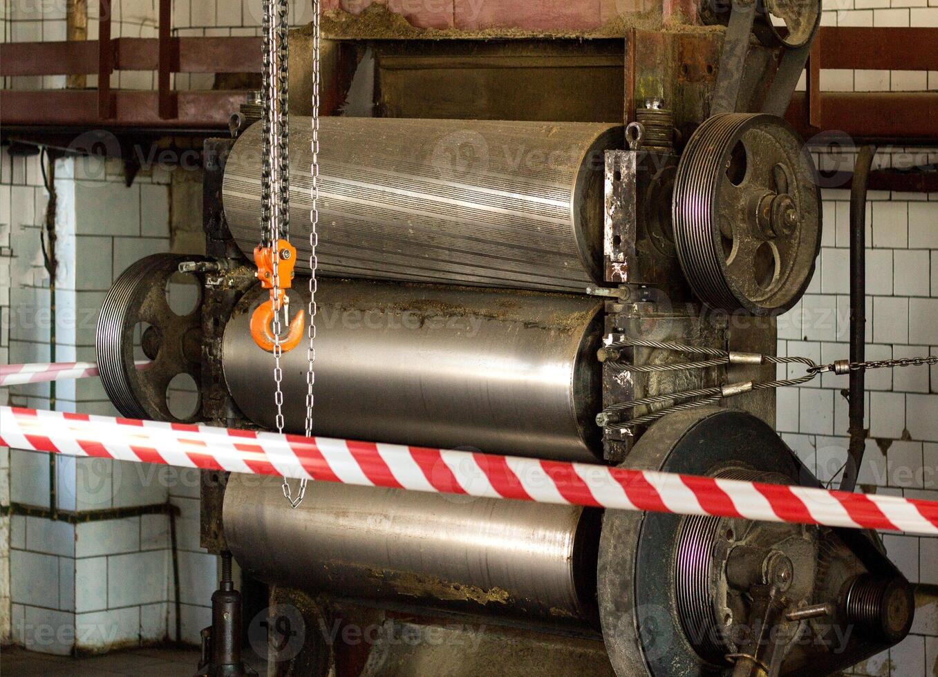 Production equipment rollers are fenced with protective tape, an investigation is underway, an incident, an industrial accident, danger, workshop photo