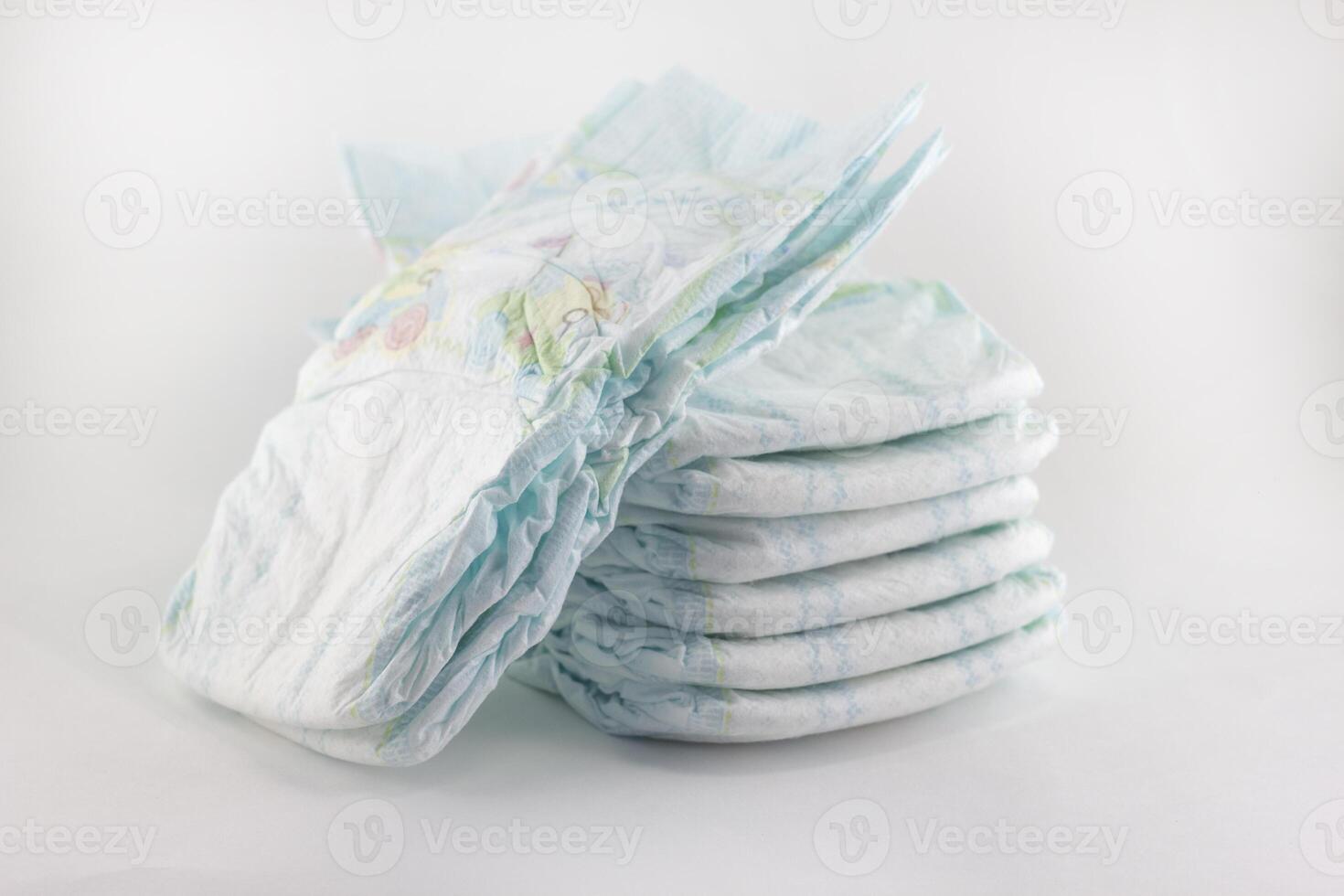 Baby diapers on a white background photo