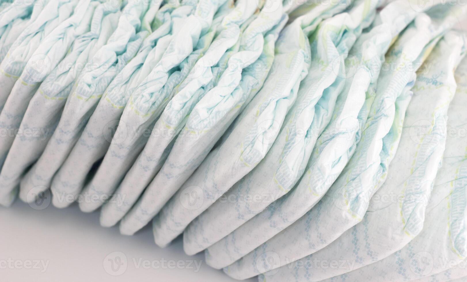 Baby diapers on a white background photo
