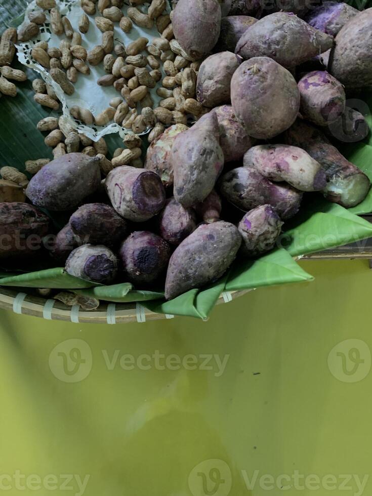 Traditional healthy snacks menu for parties in Indonesia, there are sweet corn, stewed peanuts, potatoes, bananas and breadfruit fresh from steamer. photo