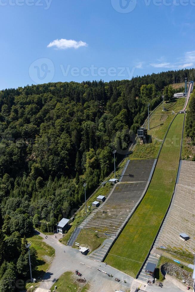 A large hill with a ski slope photo