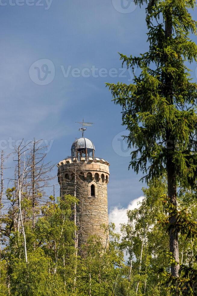A tower with a clock on top of it photo