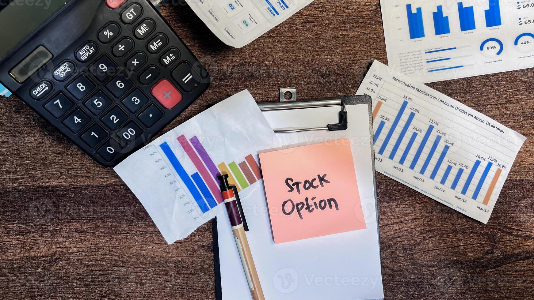 Concept of Stock Option write on sticky notes isolated on Wooden Table. photo