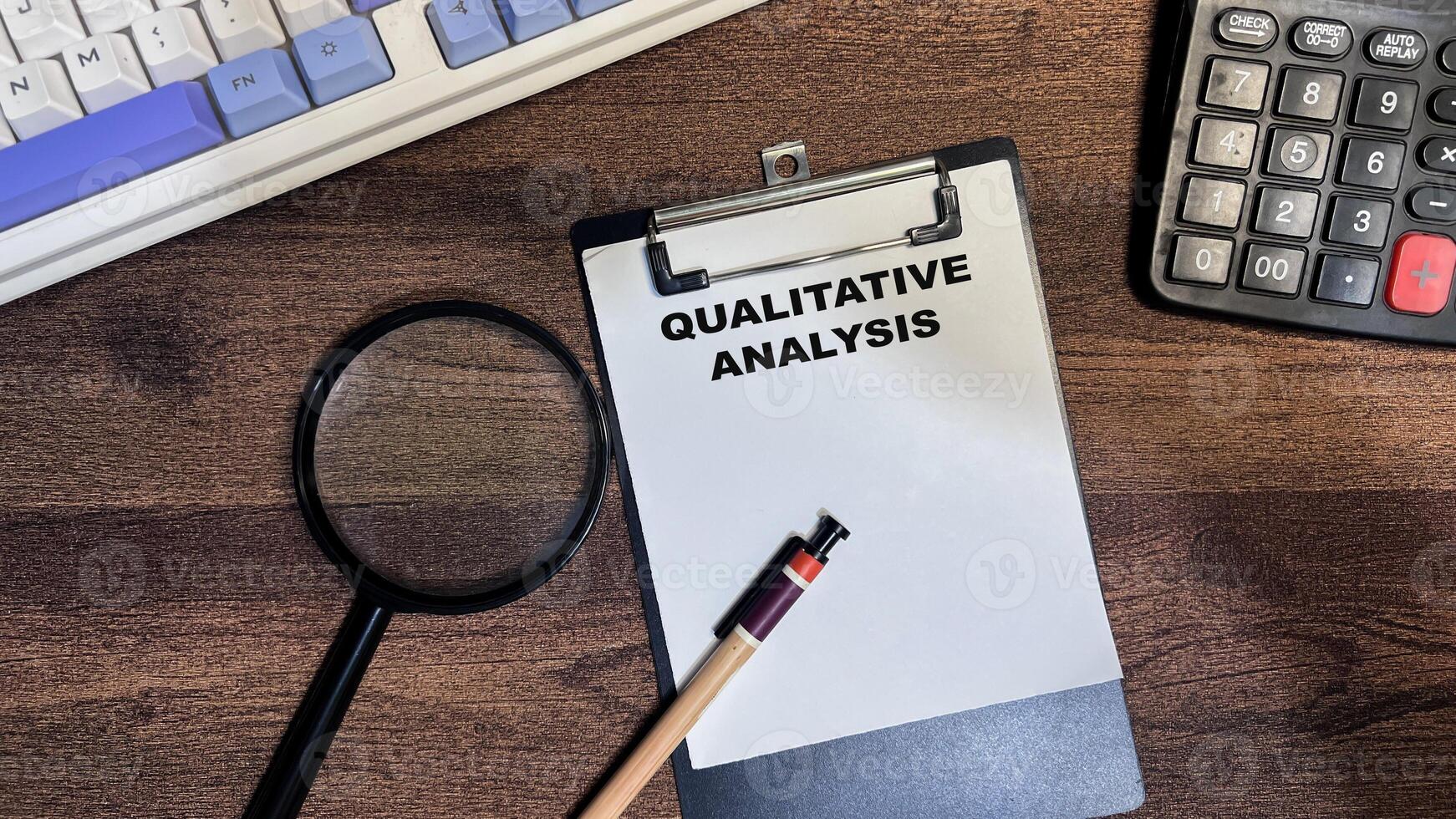 Concept of Qualitative Analysis write on paperwork isolated on Wooden Table. photo
