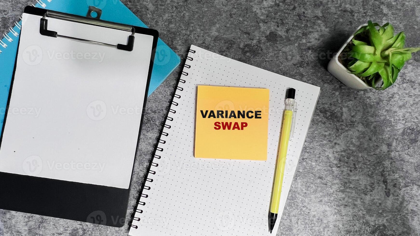Concept of Variance Swap write on sticky notes isolated on Wooden Table. photo