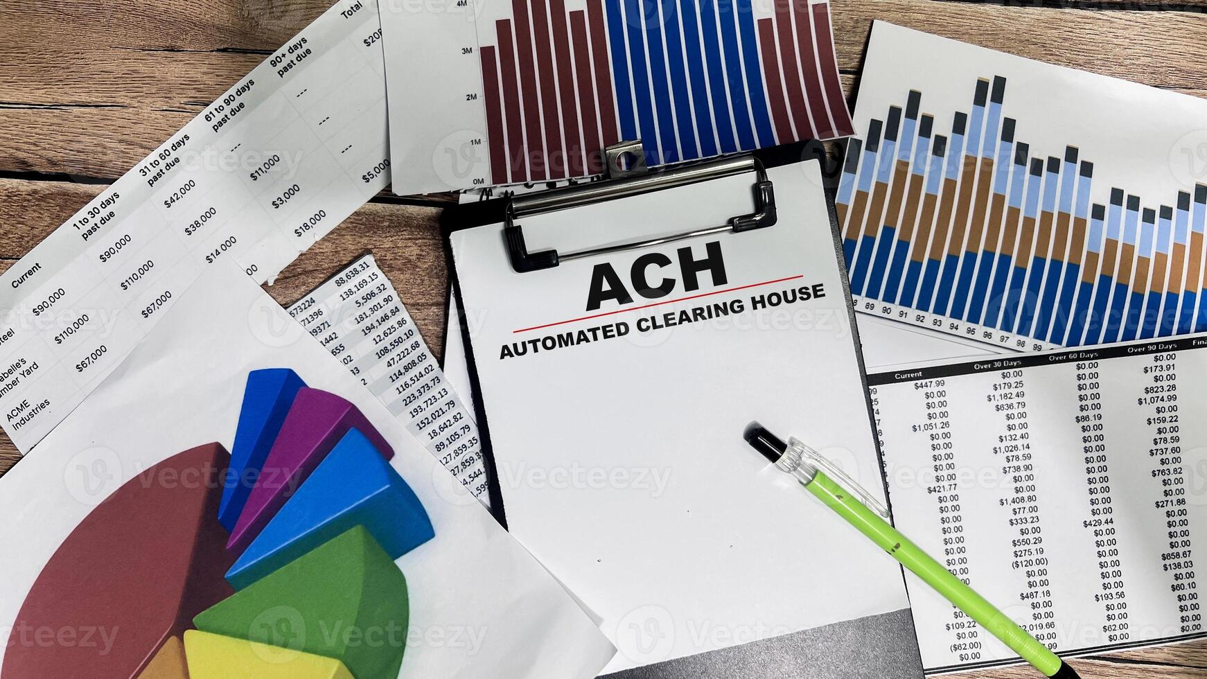Concept of ACH - Automated Clearing House write on paperwork isolated on Wooden Table. photo