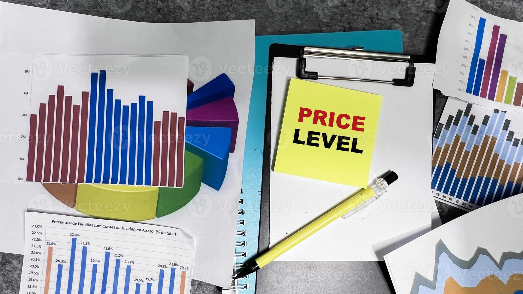Concept of Price Level write on sticky notes isolated on Wooden Table. photo