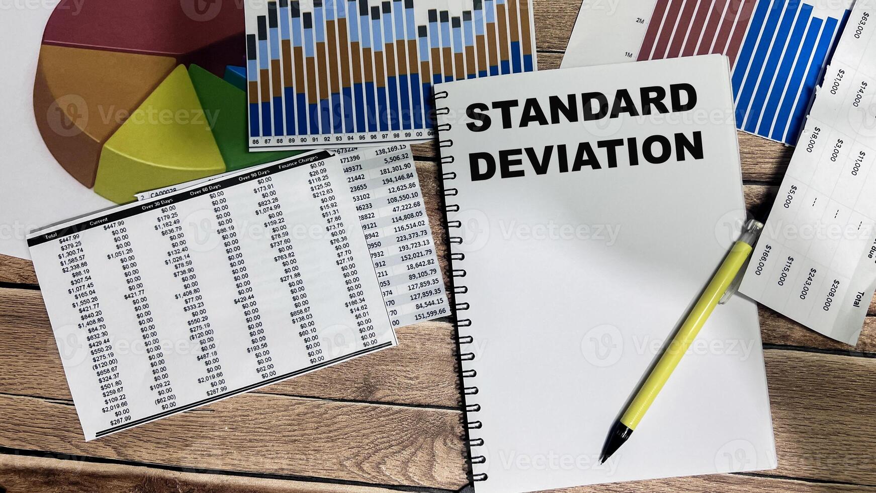 Concept of Standard Deviation write on book isolated on Wooden Table. photo