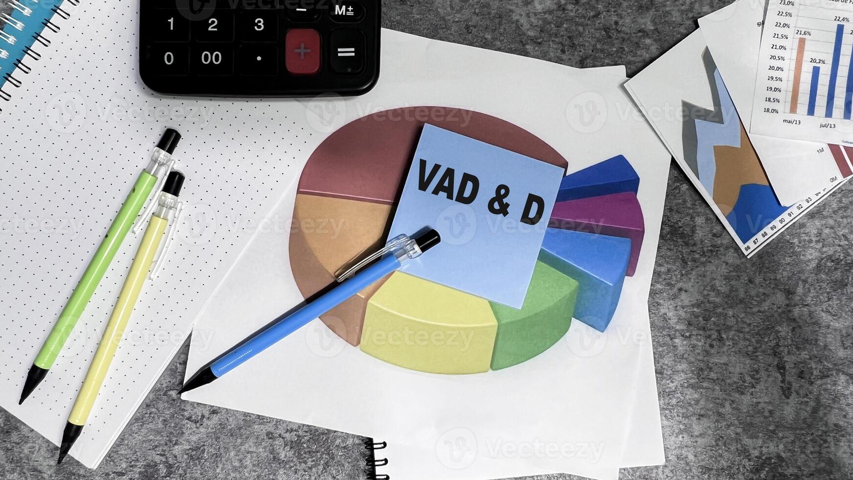 Concept of VAD D write on sticky notes isolated on Wooden Table. photo