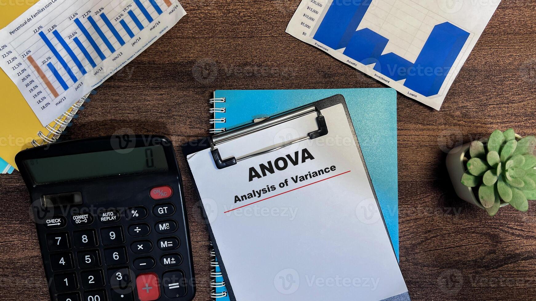 Concept of ANOVA - Analysis of Variance write on paperwork isolated on Wooden Table. photo