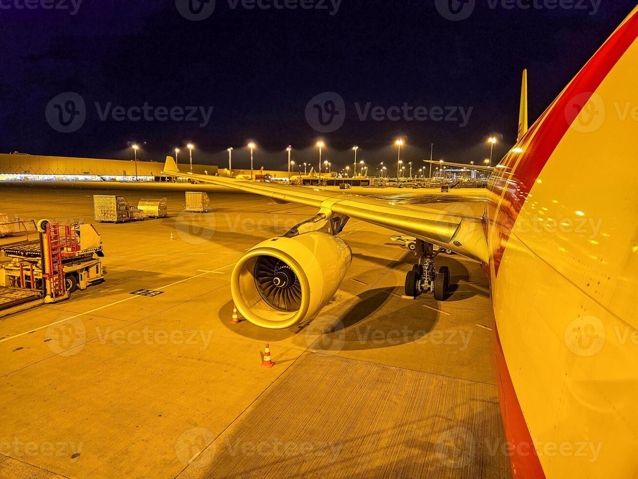 Night View of Airplane on Airport Tarmac with Engine and Lights. High quality photo