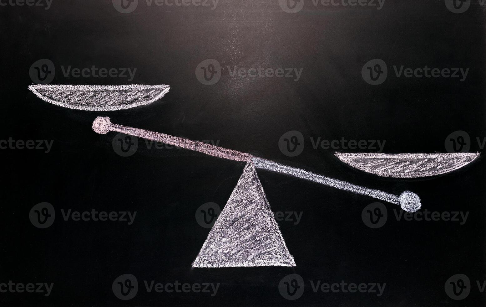 comparison mock up, scale drawn with chalk on black board, copy space for writing. ideal for visualizing oppositions or competitions or comparison of something photo