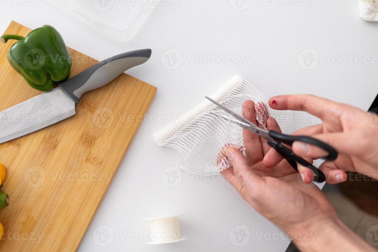 first aid for cuts and injuries, person cutting bondage photo
