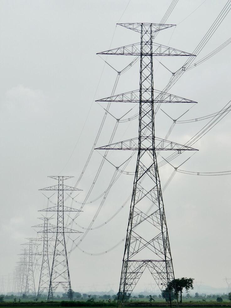 High voltage electric tower line pylon for distribution of electricity. photo
