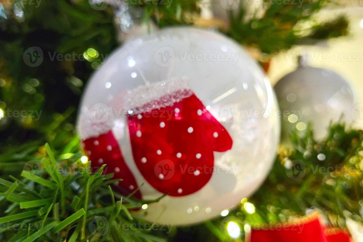 Festive Christmas Ornament with Red Mittens on Holiday Tree photo
