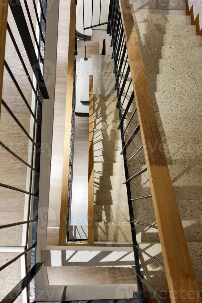 Modern Staircase Design with Wooden and Metal Elements in Interior Architecture photo