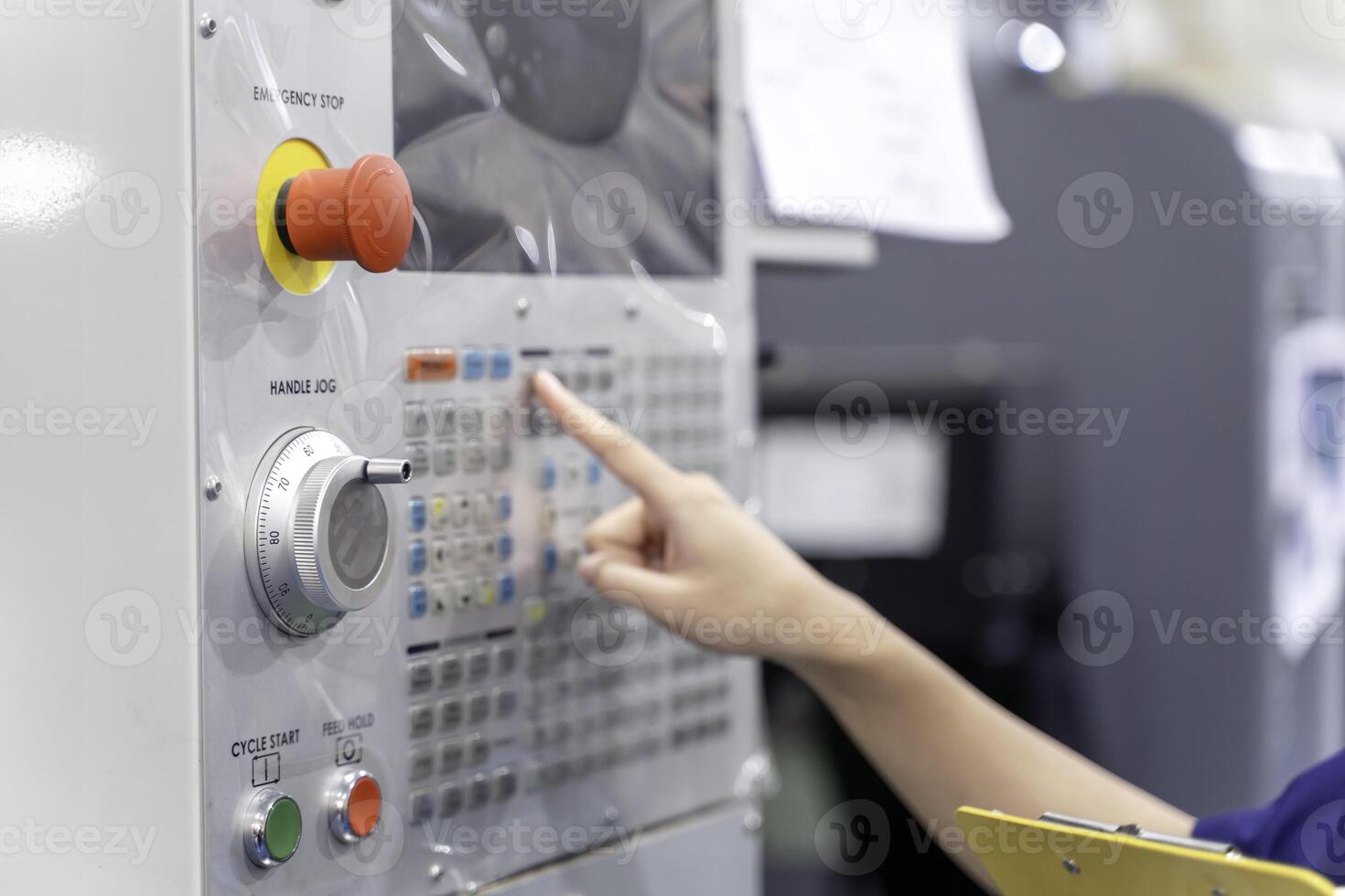 Closeup and crop hand of technician Engineer touch, press the button of automated machinery photo