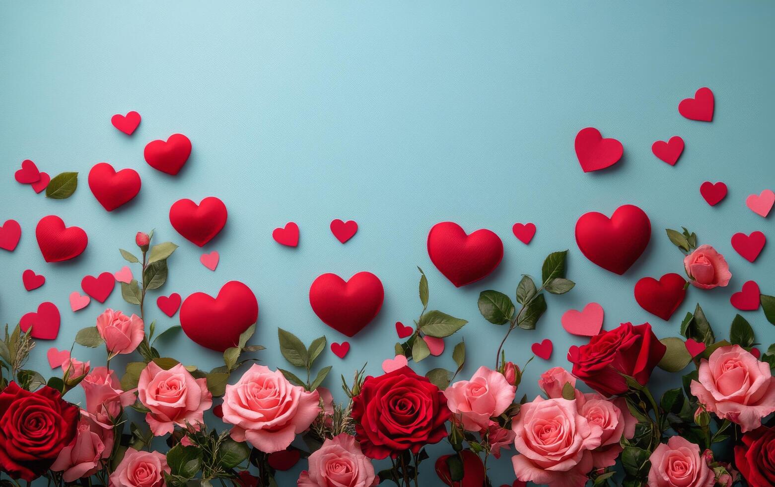 Beautiful arrangement of pink and red roses on a light blue background with heart-shaped decorations for a photo