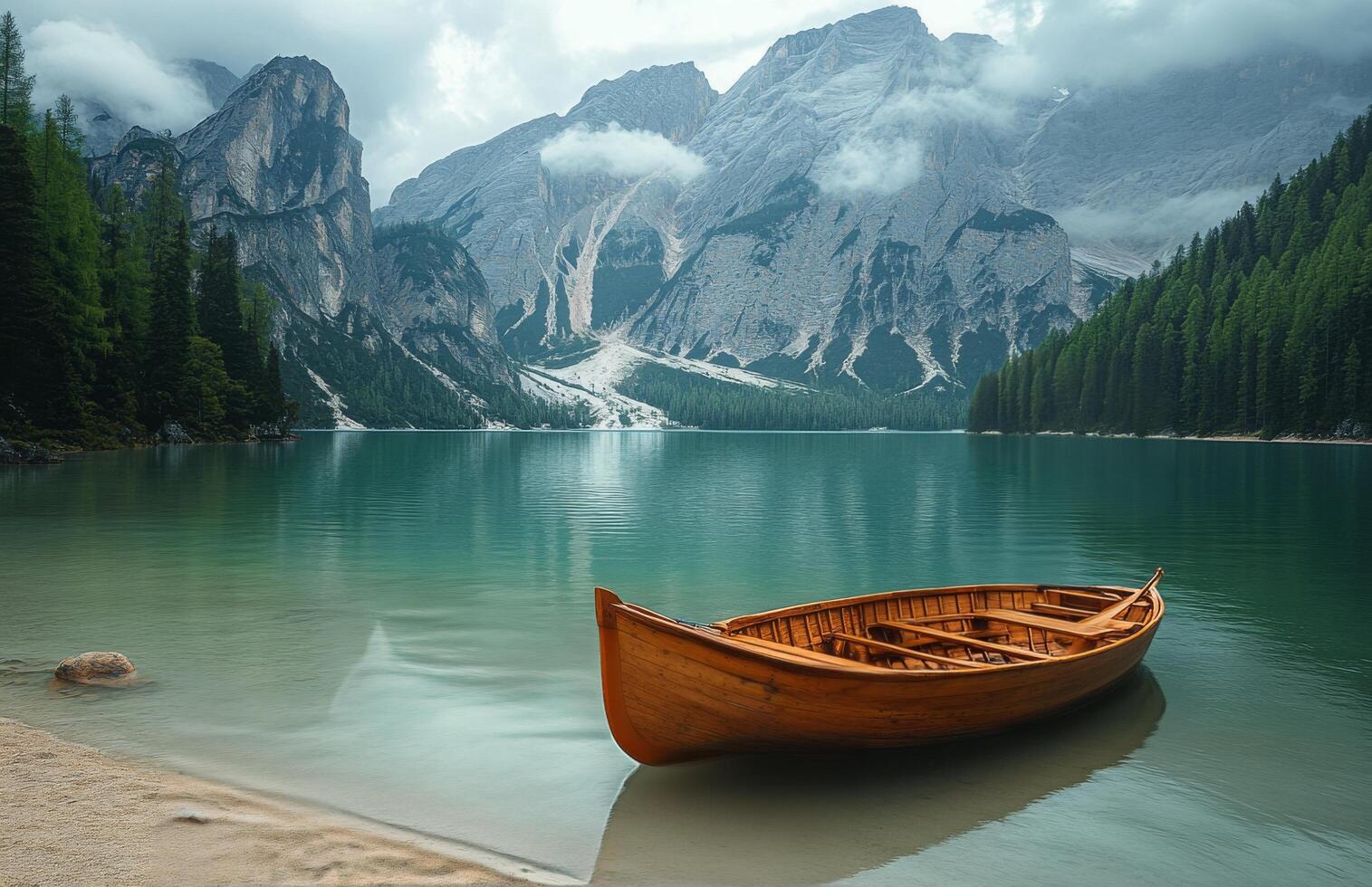 Serene lake view from wooden boat surrounded by majestic mountains and lush greenery during a sunny day photo