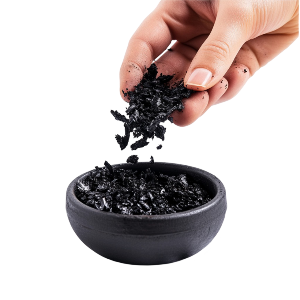 a person holding a bowl of charcoal in their hand png