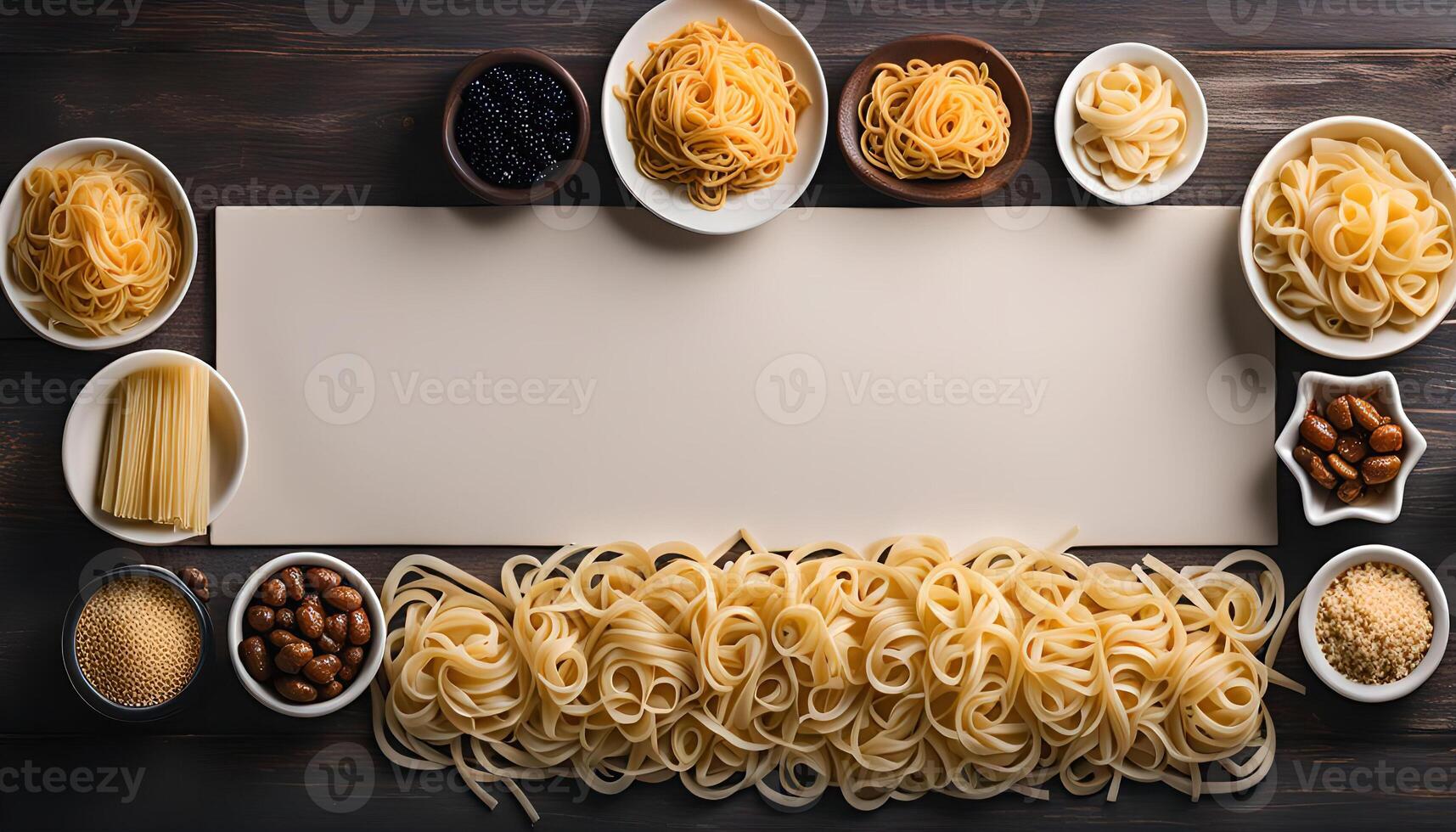 Various types of pasta on a wooden background photo