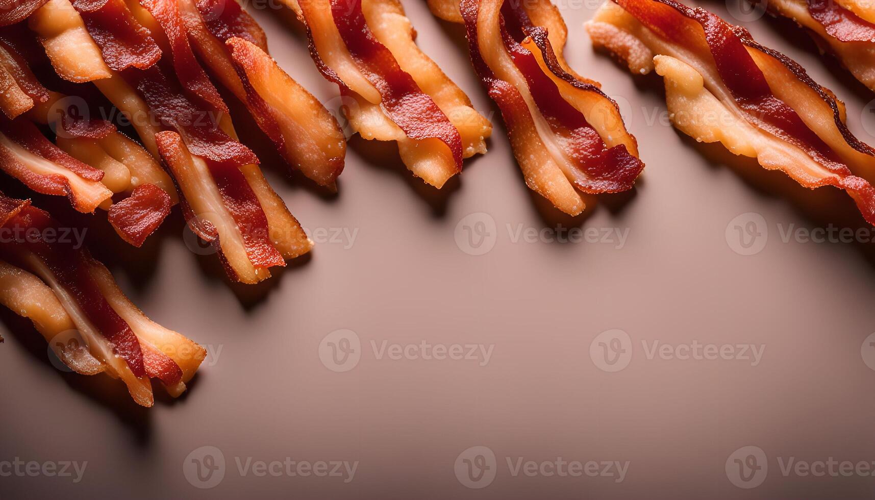 Crispy Bacon Strips on a Brown Background photo
