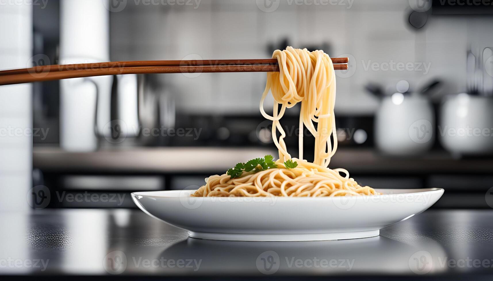 A Plate of Noodles and Chopsticks in a Modern Kitchen photo